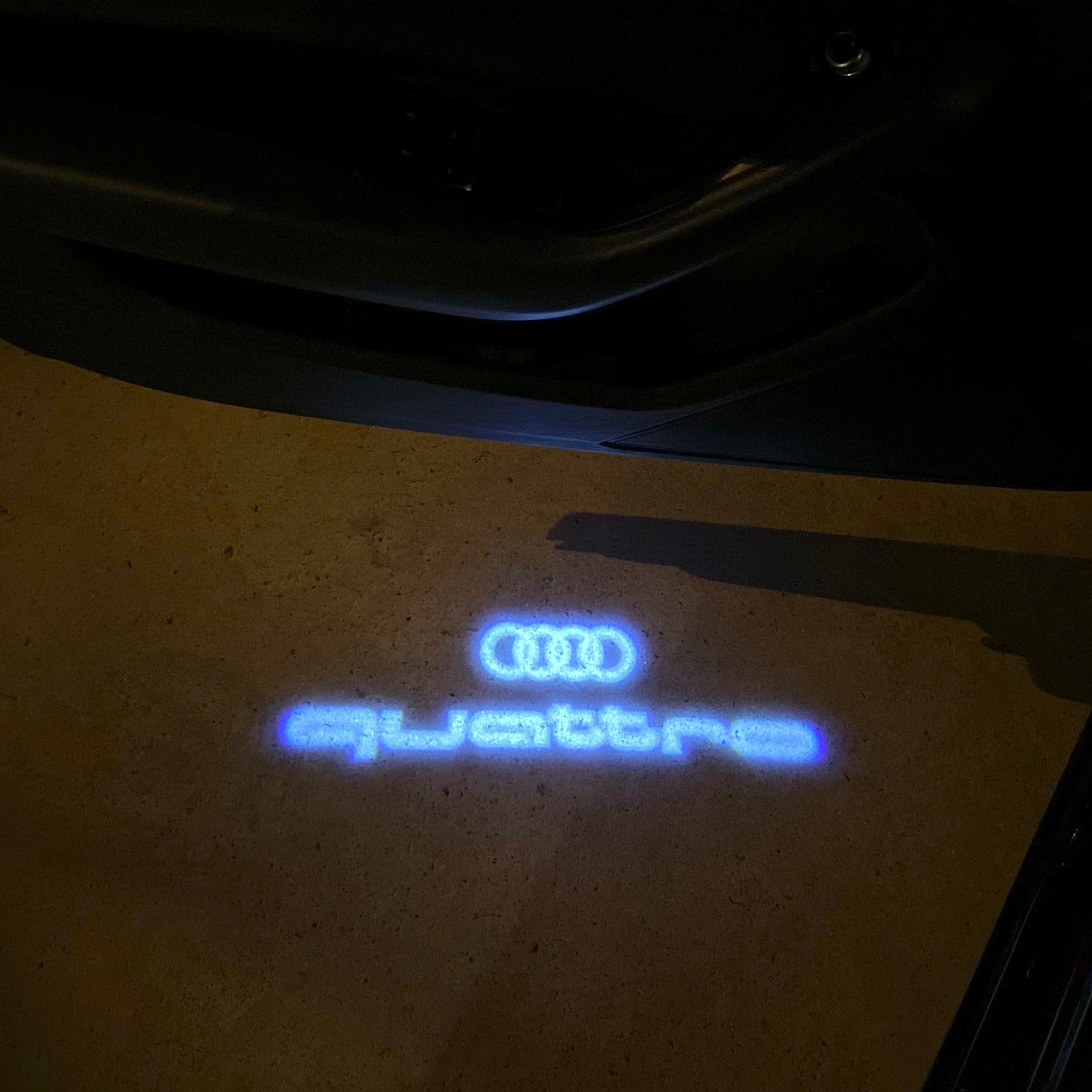 AUDI LOGO PROJECTOT LIGHTS Nr.19 (الكمية 1 = 2 Logo Films /2 أضواء الباب)