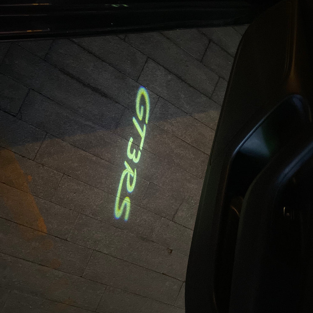 LUCI PROIETTORI LOGO ORIGINALI PORSCHE Nr.03 (quantità 1 = 2 Logo Film / 2 luci porta)