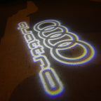 AUDI LOGO PROJECTOT LIGHTS Nr.19 (الكمية 1 = 2 Logo Films /2 أضواء الباب)