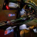 AUDI LOGO PROJECTOT LIGHTS Nr.19 (الكمية 1 = 2 Logo Films /2 أضواء الباب)
