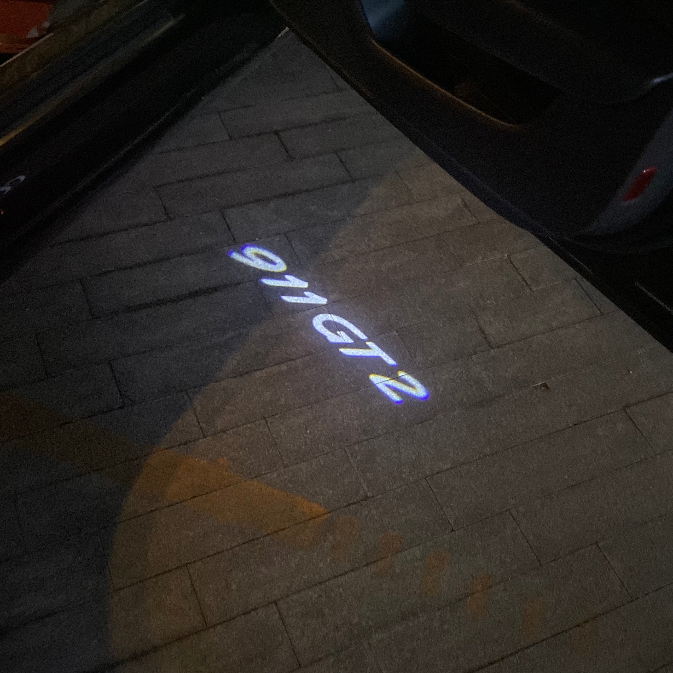 Porsche original logo projection Light No. 03 (qty. 1 = 2 logo film / 2 Door Lights)
