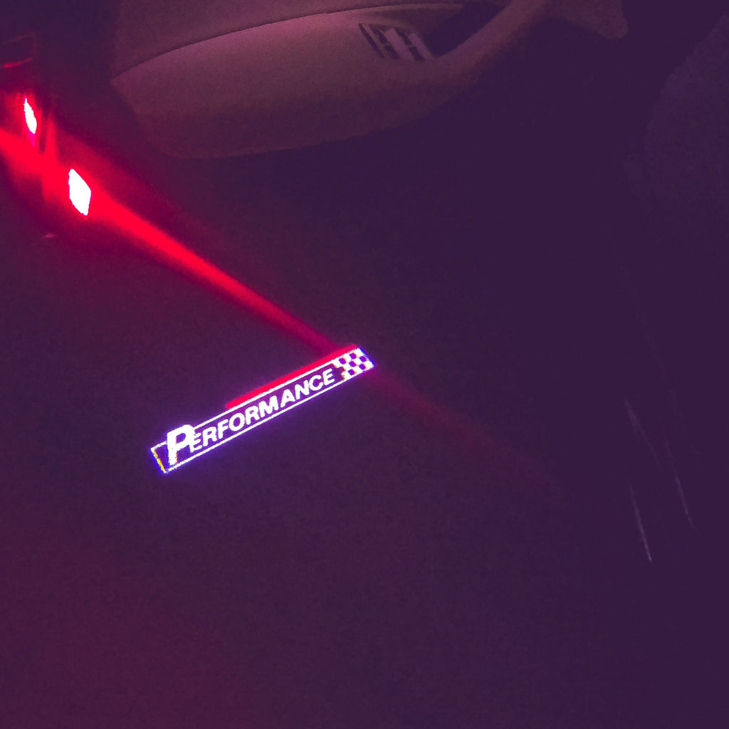 ÉCLAIRAGE DE PROJECTEUR BMW PERFORMANCE LOGO Nr.22 (quantité 1 = 1 jeux / 2 feux de porte)