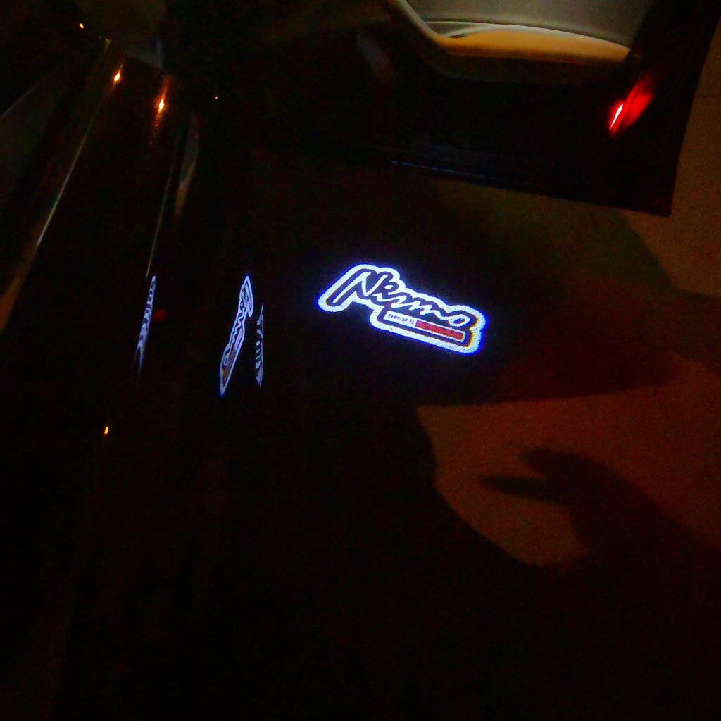 LUCI PROIETTORI LOGO NISMO Nr.10 (quantità 1 = 2 Pellicole Logo / 2 luci porta)