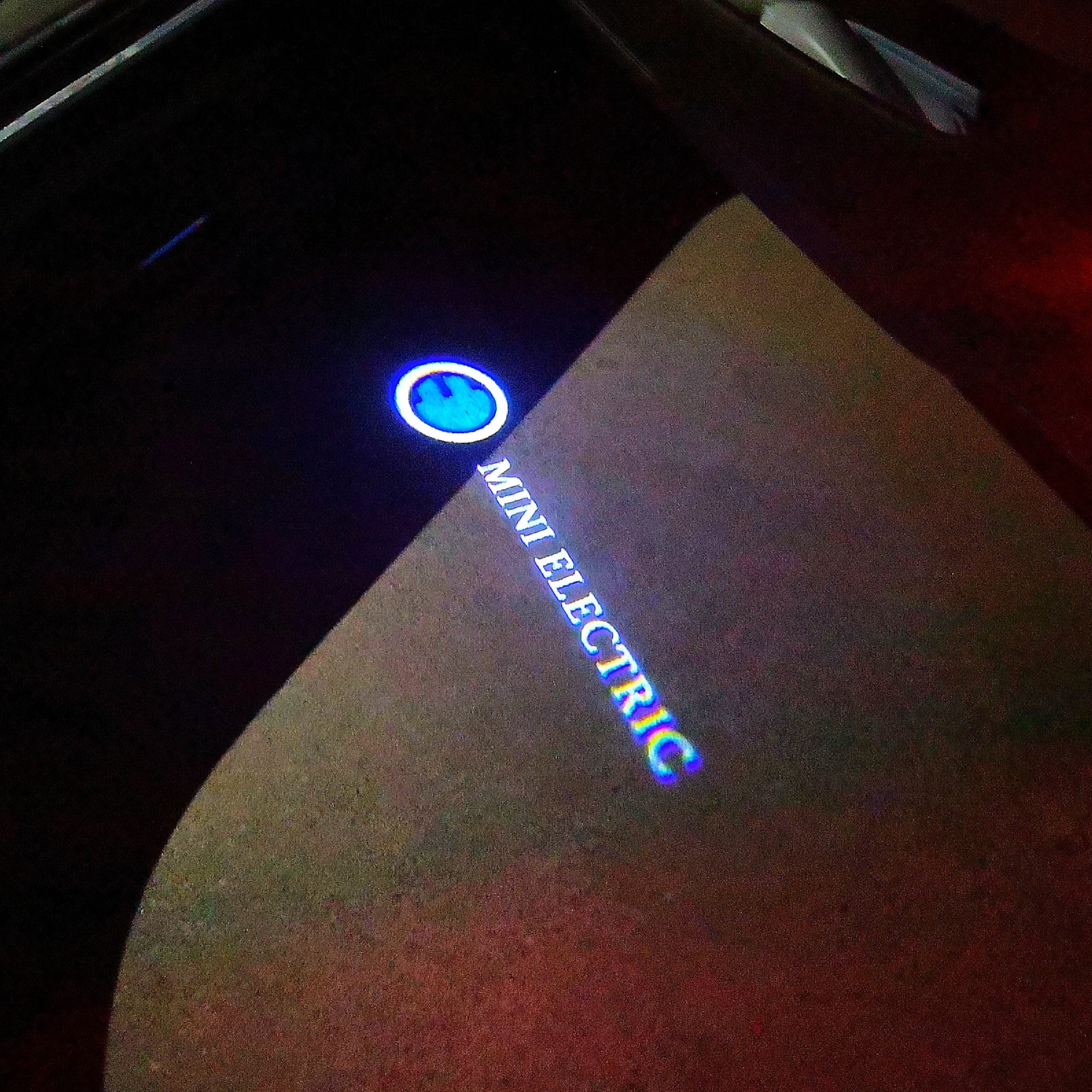 MINI ELECTRIC LOGO PROJECTOR LIGHTS Nr.62 (الكمية 1 = 2 شعار فيلم / 2 باب)