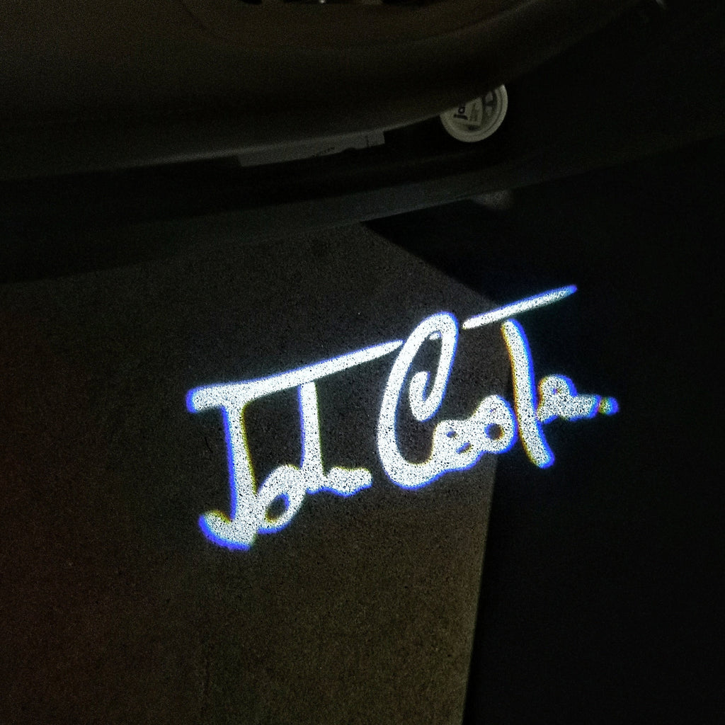 LUCES DE PROYECTOR CON LOGO JOHN COOPER Nr.84 (cantidad 1 = 2 Película con Logo / 2 luces de puerta)