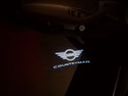 LUCES DE PROYECTOR CON LOGO DE COUNTRYMAN Nr.136 (cantidad 1 = 2 Película de Logo / 2 luces de puerta)