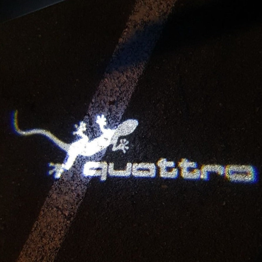 AUDI QUATTRO GECKO LOGO PROJEKTORLEUCHTEN Nr.62 (Anzahl 1 = 2 Logo Folien / 2 Türleuchten)