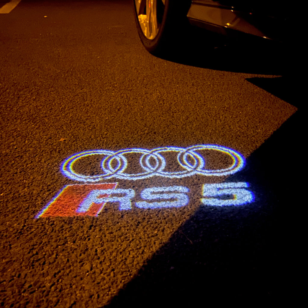 LUCI PROIETTORI LOGO AUDI Nr.136 (quantità 1 = 2 Pellicole Logo / 2 luci porta)