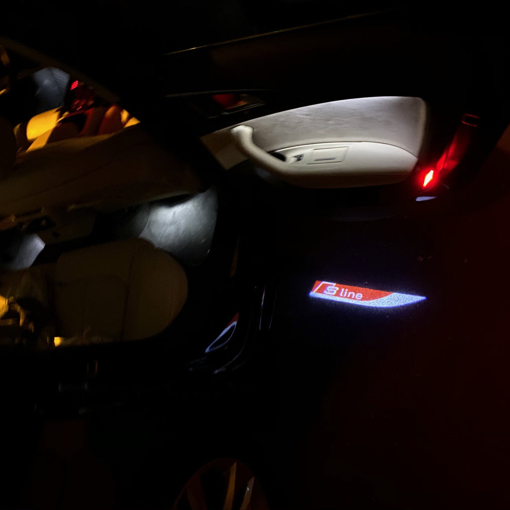 AUDI LOGO PROJECTOT LIGHTS Nr.104 (الكمية 1 = 2 Logo Films /2 أضواء الباب)