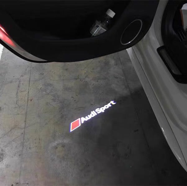 AUDI LOGO PROJECTOT LIGHTS Nr.69 (الكمية 1 = 2 Logo Films /2 أضواء الباب)