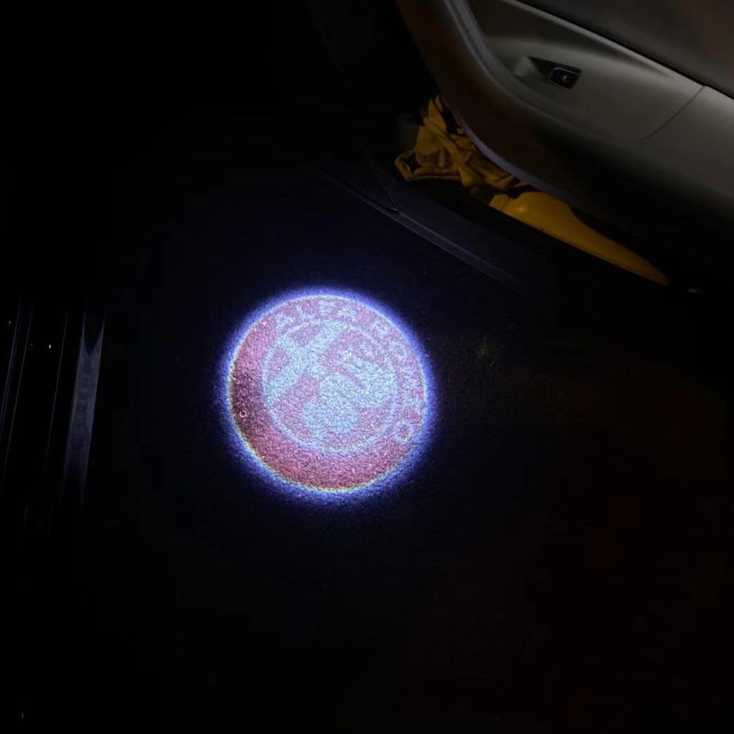 LUCI PROIETTORI LOGO Alfa Romeo Nr.23 (quantità 1 = 2 Logo Film / 2 luci porte