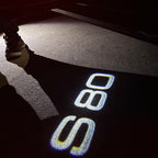 LUCES DEL PROYECTOR DEL LOGOTIPO Volvo Nr. 90 (cantidad 1 = 2 Película del logotipo / 2 luces de puerta)