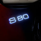LUCES DEL PROYECTOR DEL LOGOTIPO Volvo Nr. 90 (cantidad 1 = 2 Película del logotipo / 2 luces de puerta)