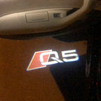 AUDI LOGO PROJECTOT LIGHTS Nr.78 (Menge 1 = 2 Logofolien /2 Türleuchten)