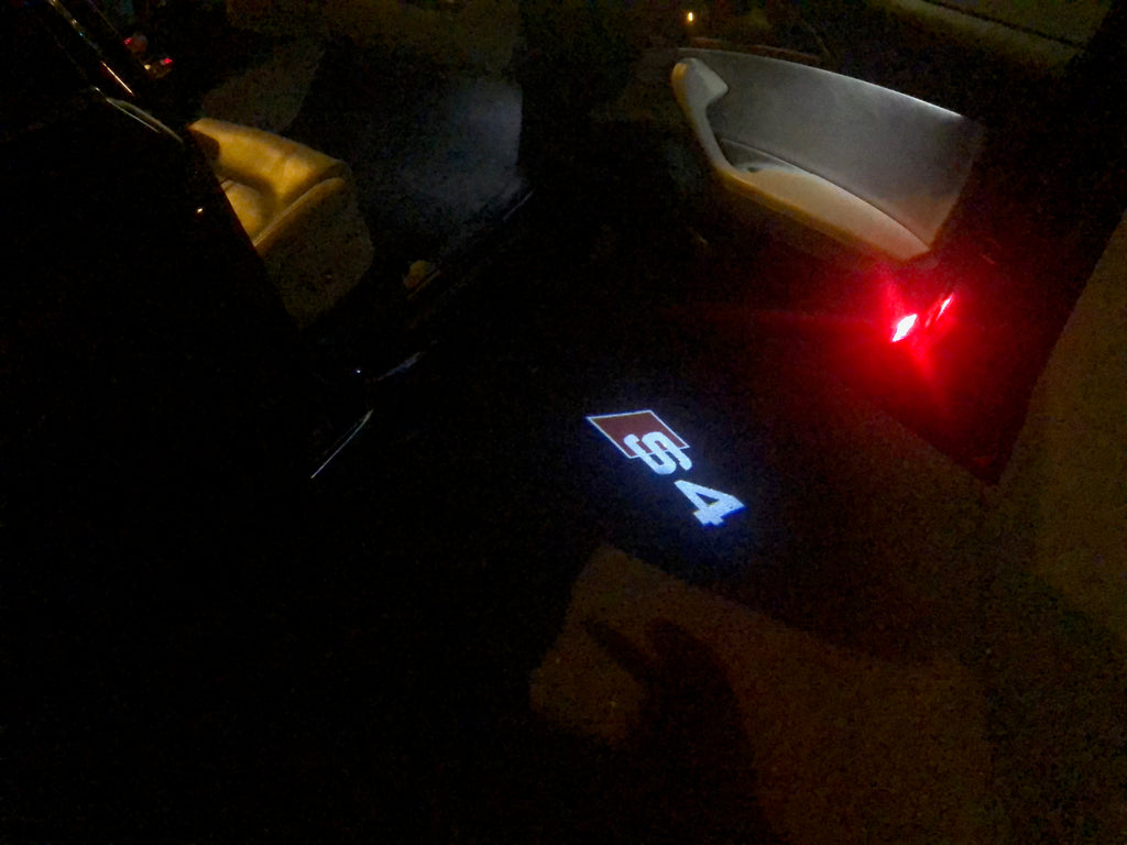 AUDI LOGO PROJECTOT LIGHTS Nr.25 (الكمية 1 = 2 Logo Films /2 أضواء الباب)