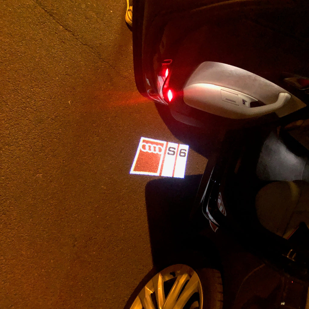 AUDI LOGO PROJECTOT LIGHTS Nr.150 (الكمية 1 = 2 Logo Films /2 أضواء الباب)