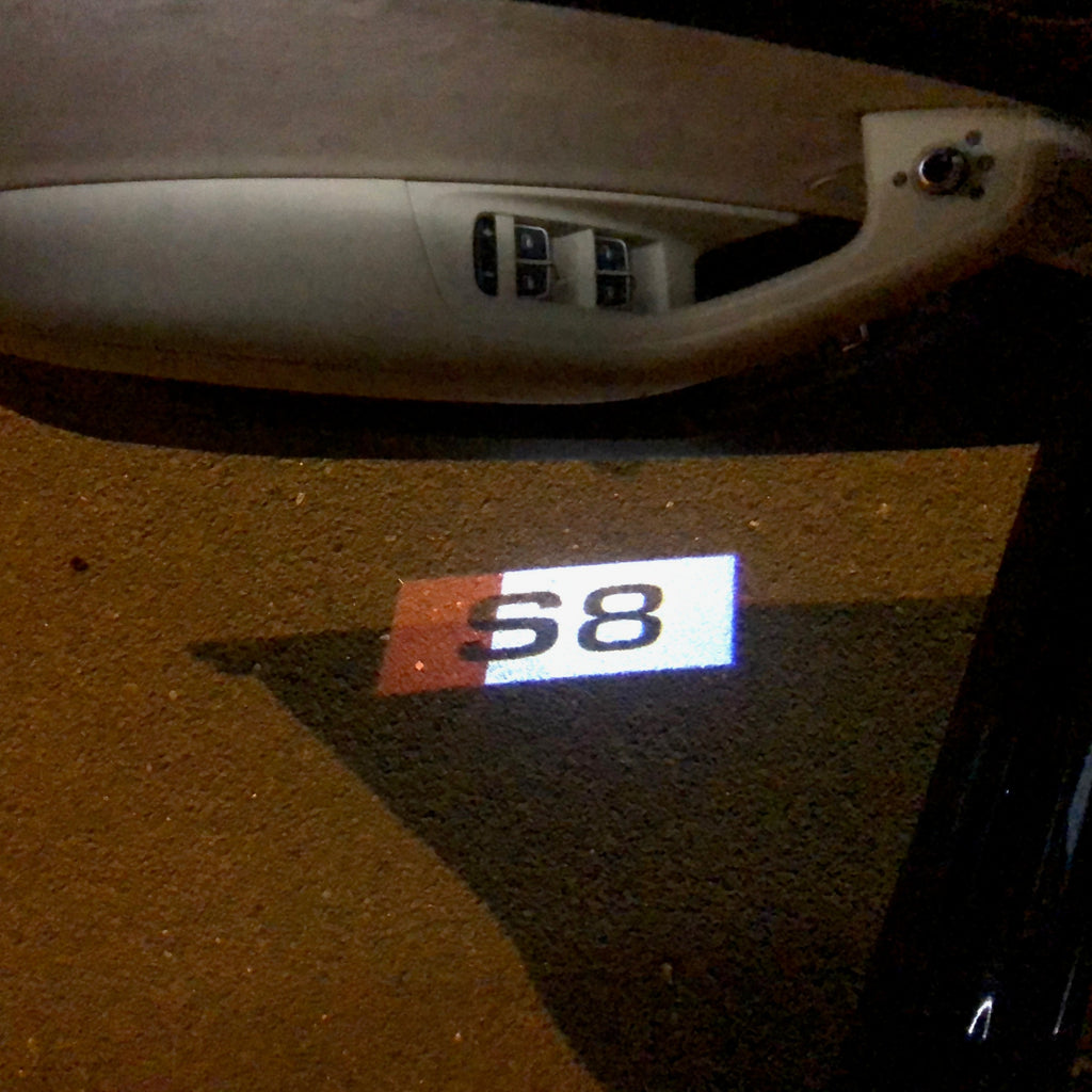 AUDI LOGO PROJECTOT LIGHTS Nr.135 (Menge 1 = 2 Logofolien /2 Türleuchten)