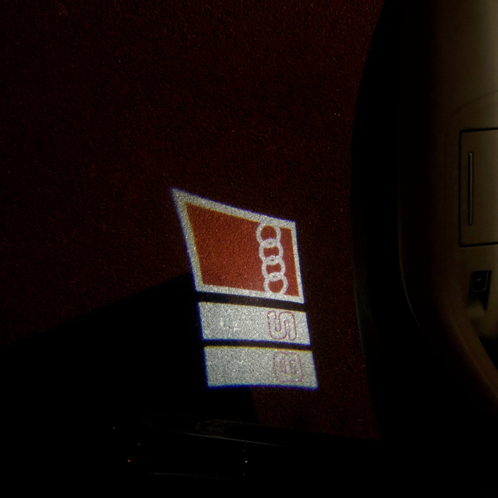 AUDI LOGO PROJECTOT LIGHTS Nr.103 (الكمية 1 = 2 Logo Films /2 أضواء الباب)