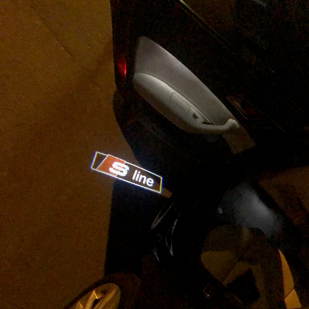 AUDI LOGO PROJECTOT LIGHTS Nr.99 (الكمية 1 = 2 Logo Films /2 أضواء الباب)