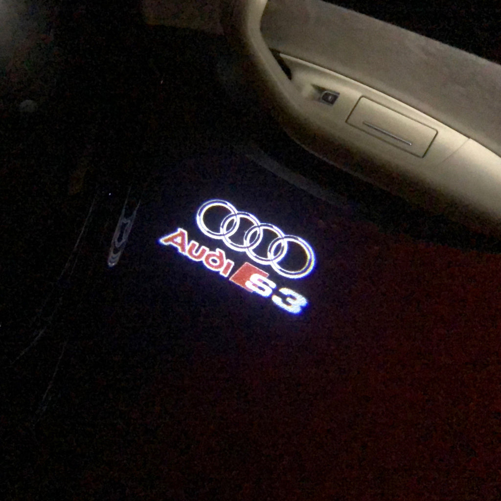 AUDI LOGO PROJECTOT LIGHTS Nr.33 (الكمية 1 = 2 Logo Films /2 أضواء الباب)