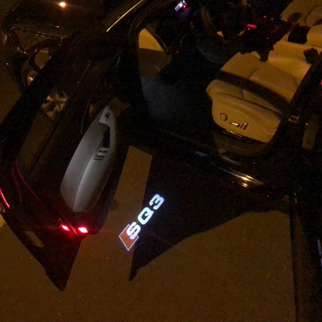 أضواء جهاز عرض شعار AUDI رقم 57 (الكمية 1 = 2 فيلم شعار / 2 مصباح باب)