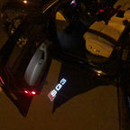 أضواء جهاز عرض شعار AUDI رقم 57 (الكمية 1 = 2 فيلم شعار / 2 مصباح باب)