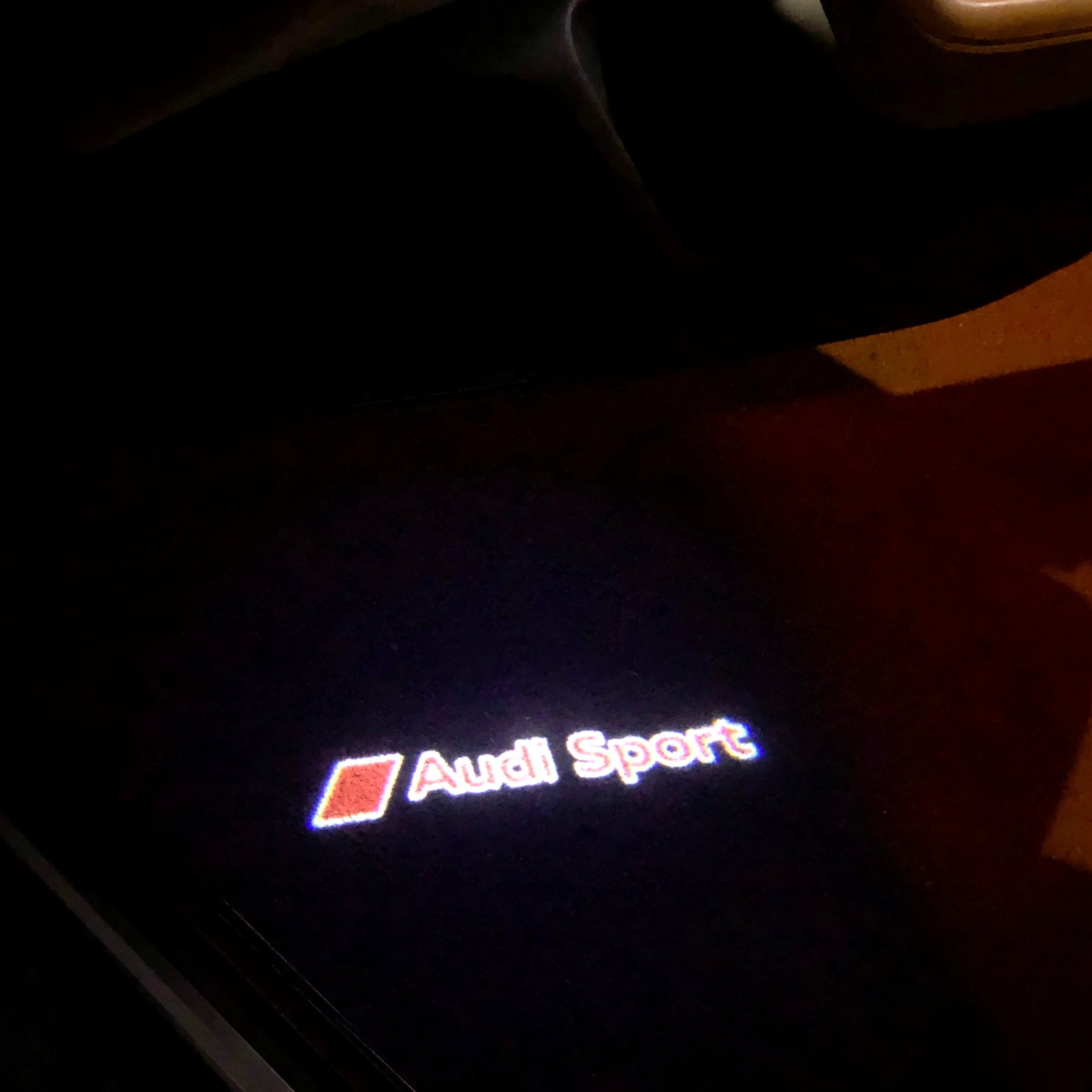 أضواء جهاز عرض شعار AUDI رقم 31 (الكمية 1 = 2 فيلم شعار / 2 مصباح باب)
